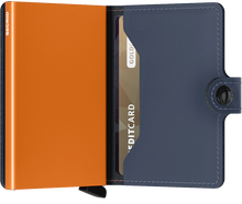 Load image into Gallery viewer, Interior view of the blue and orange mini wallet. 
