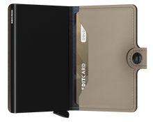Load image into Gallery viewer, Interior view of a light sand colored mini wallet. The aluminum case inside is black. 
