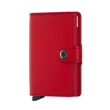 Load image into Gallery viewer, Angled front view of the red mini-wallet with button closure
