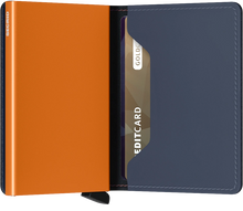 Load image into Gallery viewer, Interior view of the orange and blue slim wallet. The aluminum card case is orange. 
