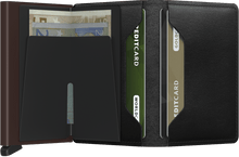 Load image into Gallery viewer, Interior view of the black and brown slim wallet. The back of the aluminum card case features a bill fold. 
