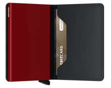 Load image into Gallery viewer, Interior view of the black and red wallet. The aluminum card case is red. 
