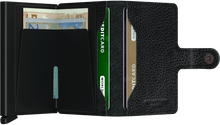 Load image into Gallery viewer, Interior view of the mini wallet. The left side offers a money clip, and the right side two compartments to slide cards in.
