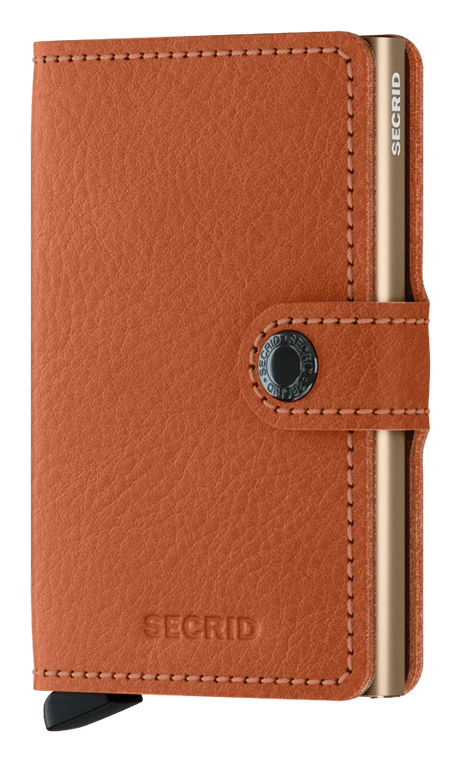 Angled front panel view of the tan colored mini wallet. 