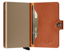 Load image into Gallery viewer, Interior view of the tan brown mini wallet. The aluminum card case is a light sand brown color. 
