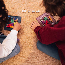 Load image into Gallery viewer, Two children playing with the game boards.
