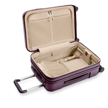 Load image into Gallery viewer, Interior View of the plum-colored suitcase. The lining is light brown. The front panel side features a zipper-closing compartment with organizational features, and the back panel a lining with straps to hold contents in place. 
