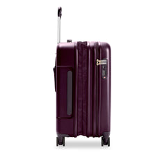 Load image into Gallery viewer, Side view of the plum-colored hard shell suitcase with the telescopic handle partly extended. A grabbing handle and a three-digit TSA combination lock are visible.The expandable feature is unzipped. 

