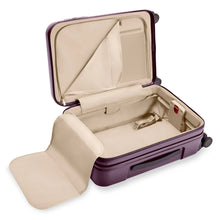 Load image into Gallery viewer, Interior View of the plum-colored suitcase. The lining is light brown. The front panel side features a zipper-closing compartment with organizational features, and the back panel a lining with straps to hold contents in place. 
