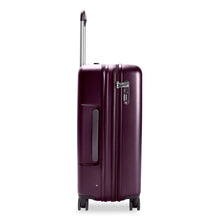 Load image into Gallery viewer, Side view of the plum-colored hard shell suitcase with the telescopic handle partly extended. A grabbing handle and a three-digit TSA combination lock are visible.
