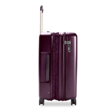 Load image into Gallery viewer, Side view of the plum-colored hard shell suitcase with the telescopic handle partly extended. A grabbing handle and a three-digit TSA combination lock are visible.The expandable feature is unzipped. 
