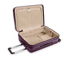 Load image into Gallery viewer, Interior View of the plum-colored suitcase. The lining is light brown. The front panel side features a zipper-closing compartment with organizational features, and the back panel a lining with straps to hold contents in place. 
