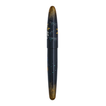 Load image into Gallery viewer, The back of the fountain pen, black and gold with decorative elements on a white background.
