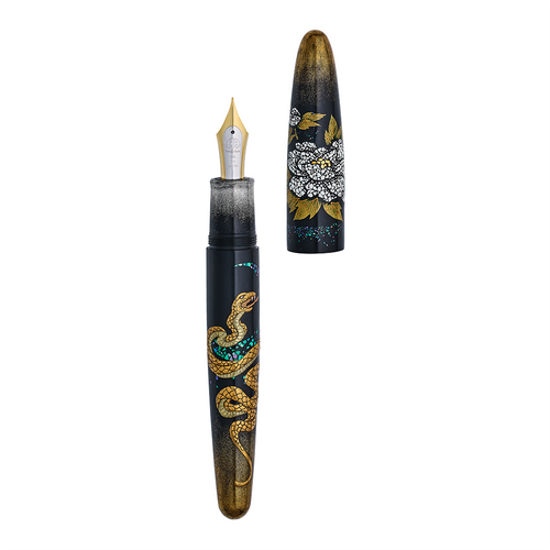 Fountain pen with snake and floral design on a white background, the pen is uncapped demonstrating its two toned nib.