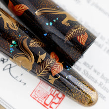 Load image into Gallery viewer, Close up to the pens&#39; barrel and cap focusing on the autumn leaves.
