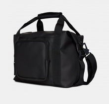 Load image into Gallery viewer, Angled front panel view of the black kit bag
