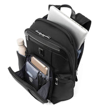 Load image into Gallery viewer, Angled top panel view of the backpack with the back and front pockets unzipped. The back panel has a laptop peeking from its compartment. The front has pens and a notebook. The side pocket has a water bottle. Accessories not included).
