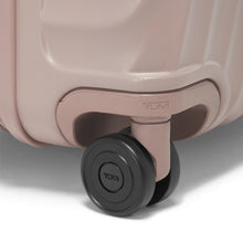 Load image into Gallery viewer, Close up to a black wheel on the suitcase. 
