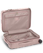 Load image into Gallery viewer, Interior view of the suitcase showing a zipper-closing compartment, organizational pockets, and a set of straps to hold  your contents. 
