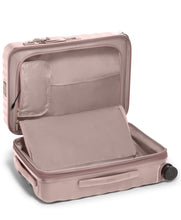 Load image into Gallery viewer, Interior view of the suitcase showing the unzipped compartment on the front panel. 

