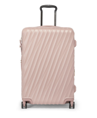 Front panel view of the mauve suitcase with black accents. It features a sleek design of diagonal ridges on the back and front panels. 