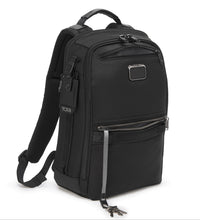 Load image into Gallery viewer, Angled front panel view of the backpack with light gray accents. The bottom front pocket interior features a cord with a clip to attach your keys. 
