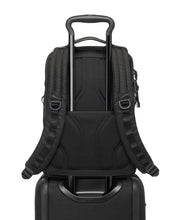 Load image into Gallery viewer, Back panel view of the backpack&#39;s attachment feature. A suitcase&#39;s telescopic handle can pass through to hold it in place. 
