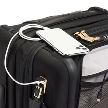 Load image into Gallery viewer, Close up to the top of the suitcase, showing the phone charging on the USB plug available on the side panel. Portable battery not included.
