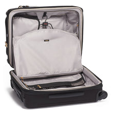 Load image into Gallery viewer, Interior view of the suitcase. it features a light gray lining, and a foldable garment bag.
