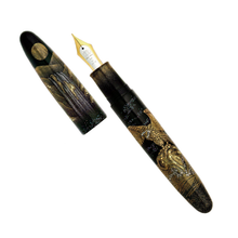 Load image into Gallery viewer, A decorative fountain pen with a black and gold eagle illustration, shown with its cap off on a plain white background.
