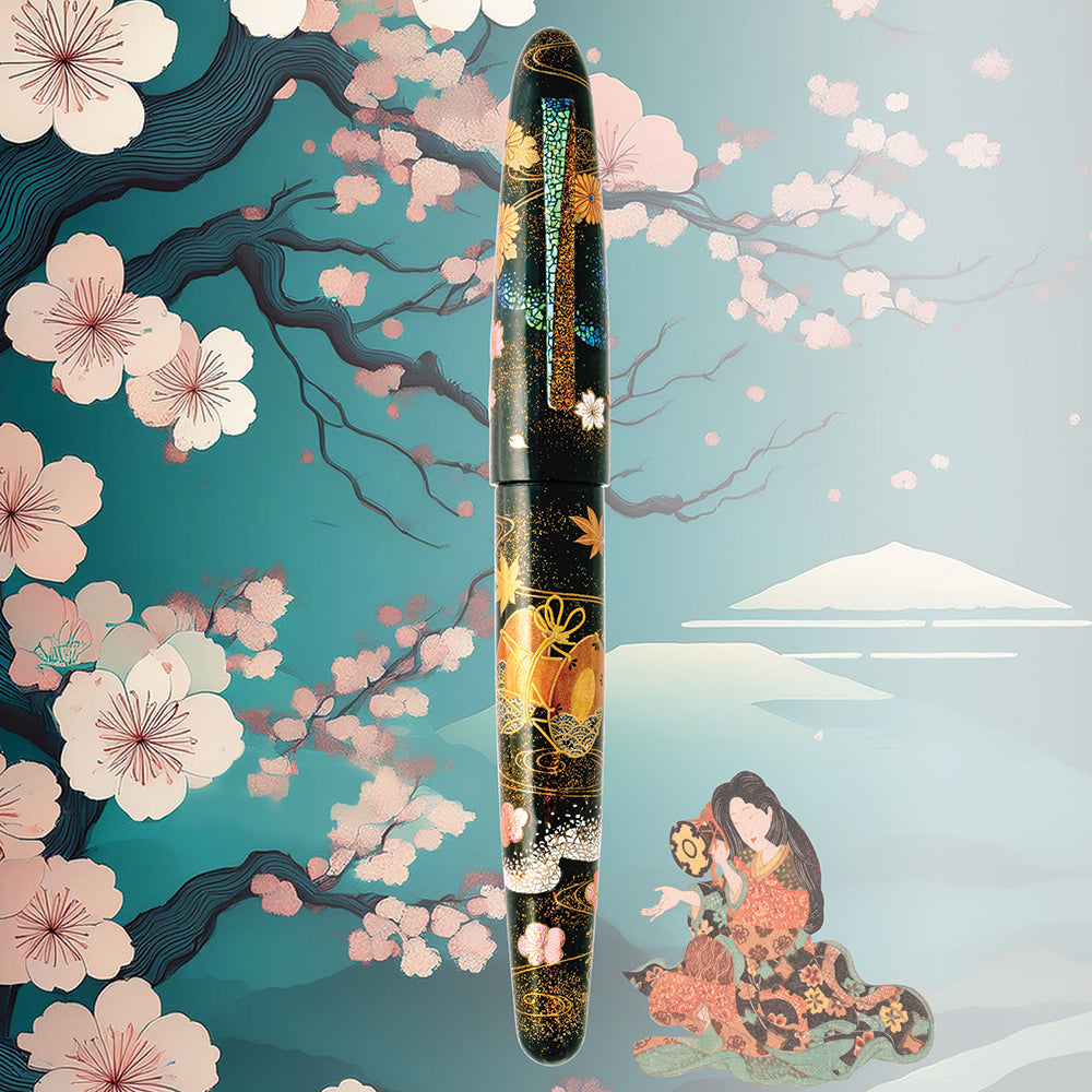 The pen is displayed on a green background with a sakura tree, a geisha with a drum, and Mount Fuji.