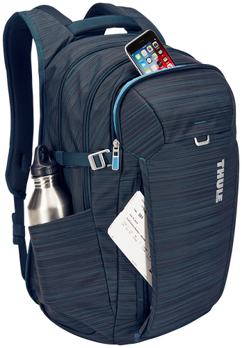Angled front panel view of the blue backpack with a travel ticket, a cellphone and a water bottle arranged within the compartments. (Accessories not included).