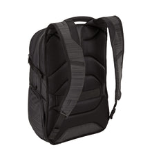 Load image into Gallery viewer, Angled back view of the black backpack, featuring the padded back panel and adjustable straps. 
