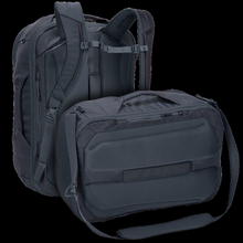Load image into Gallery viewer, Back panel view of the backpack shown vertically with the shoulder straps and laid horizontally with the messenger bag strap. 
