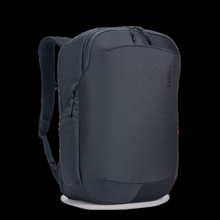 Load image into Gallery viewer, Angled front panel view of the blue backpack. 
