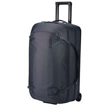 Load image into Gallery viewer, Angled front panel view of the Dark Slate wheeled duffle with the telescopic handle partly extended. 
