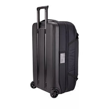 Load image into Gallery viewer, Angled back panel view of the black wheeled duffle bag. 

