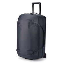 Load image into Gallery viewer, Angled front panel view of the Dark Slate duffle bag with the telescopic handle partly extended.
