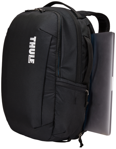 Angled front panel view of the black backpack with a laptop peeking from the side compartment. 