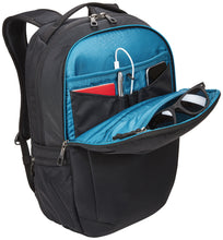 Load image into Gallery viewer, Angled front panel view of the backpack with the front panel unzipped. The interior has blue lining, and features a pair of sunglasses, a pen, charging cable, phone and notebook arranged in the pockets. (Accessories not included).
