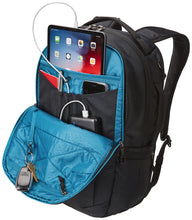 Load image into Gallery viewer, Angled front panel view showing the panel&#39;s pocket unzipped and filled with accessories. (Items not included).
