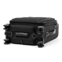 Load image into Gallery viewer, Angled view of the suitcase showing the bottom panel. 
