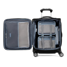 Load image into Gallery viewer, Interior view of the suitcase showing two packing cubes inside the main compartment. The front panel has a zipper-closing pocket. 
