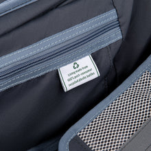 Load image into Gallery viewer, Close up to an interior tag with text: Lining made from 100% post-consumer recycled plastic bottles&quot;.
