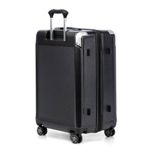 Load image into Gallery viewer, Angled back panel view of the suitcase with the telescopic handle partly extended. 
