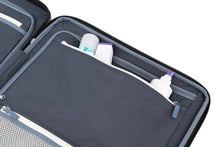 Load image into Gallery viewer, Close up to a panel divider&#39;s zipper-closing pocket filled with toiletries. 
