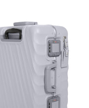 Load image into Gallery viewer, Angled close up view to the side panel. It features a grab handle, a tag, and a set of TSA approved three-digit combination lock. 
