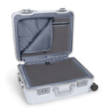 Load image into Gallery viewer, Interior view of the suitcase showing a zipper-closing divider partly opened. 
