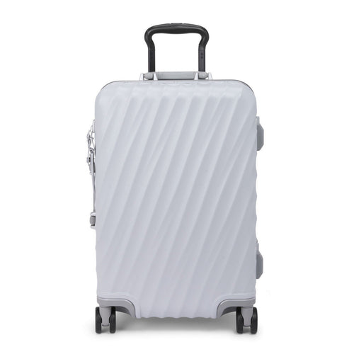 Front panel view of the pearl gray suitcase with black accents. 