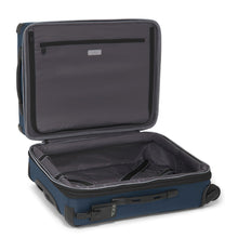 Load image into Gallery viewer, Interior view of the suitcase showing the zipper-closing panel divider and a set of adjustable straps on the back panel to hold your contents. 
